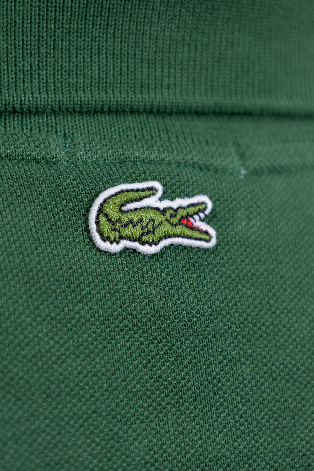 Lacoste polo best sale logo